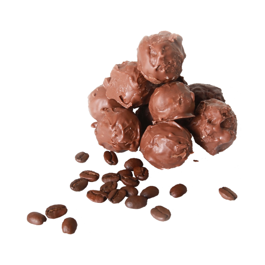 A pile of Coffee Chocolate Truffle with coffee beans scattered around.