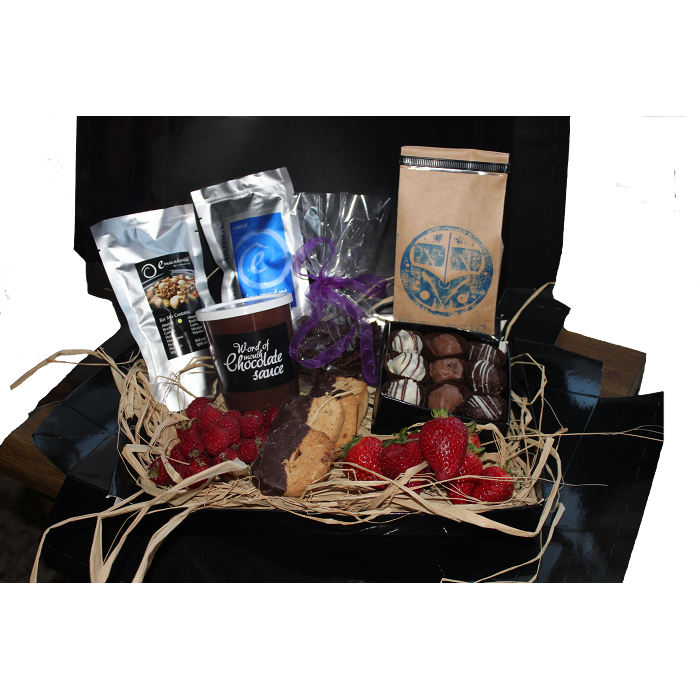 A selection of Giles Chocolatier items showcased in a black box with black lid