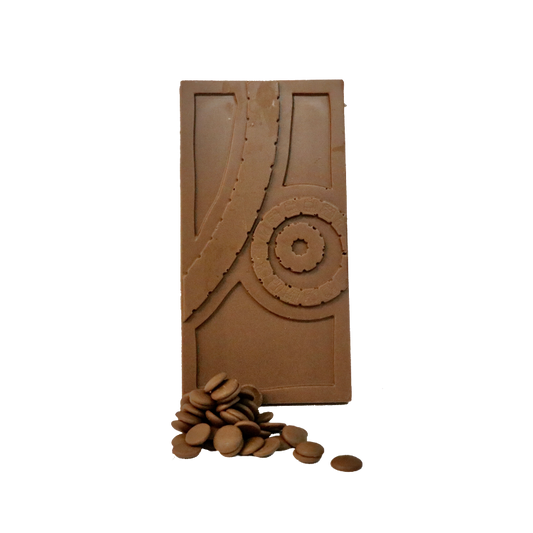 milk chocolate bar with circular pattern on it with milk chocolate buttons