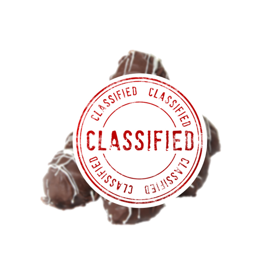 Classified sign over top of naughty looking chocolate