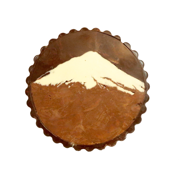 Chocolate Disk featuring a chocolate Mount Taranaki on top of it