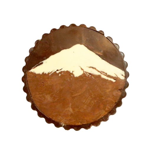 Chocolate Disk featuring a chocolate Mount Taranaki on top of it