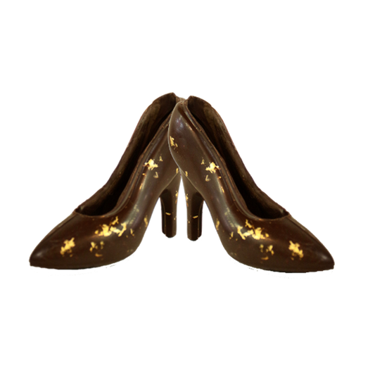 Two Gold Cinderella Slippers sitting heel to heel