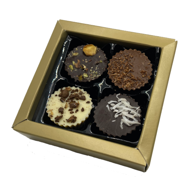 Gold coloured box of 4 chocolate bon bons