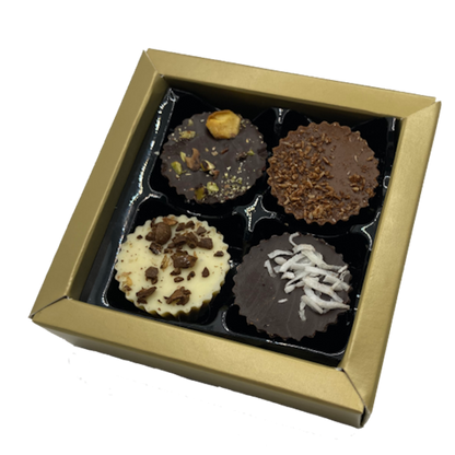 Gold coloured box of 4 chocolate bon bons