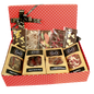 Red spotted box full with different chocolate bars and truffles from Giles Chocolatier