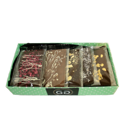 Green box containing a selection of giles chocolatier bars