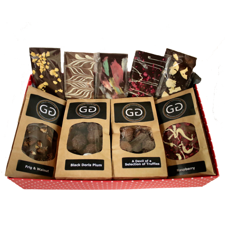 Red box containing a mixture of Giles chocolatier and truffles