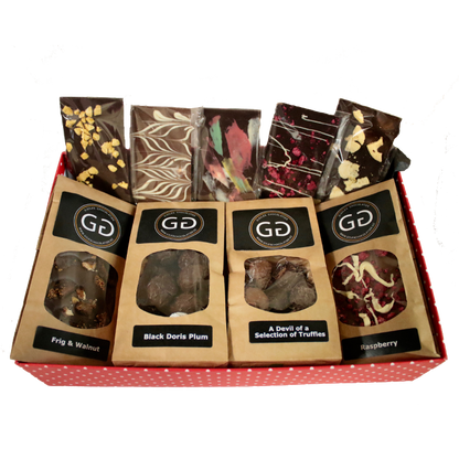 Red box containing a mixture of Giles chocolatier and truffles