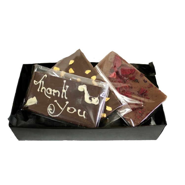 Black box full with different chocolate bars and truffles from Giles Chocolatier