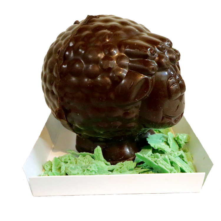 Three dimensional Chocolate Sheep standing in green chocolate grass