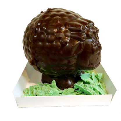 Three dimensional Chocolate Sheep standing in green chocolate grass
